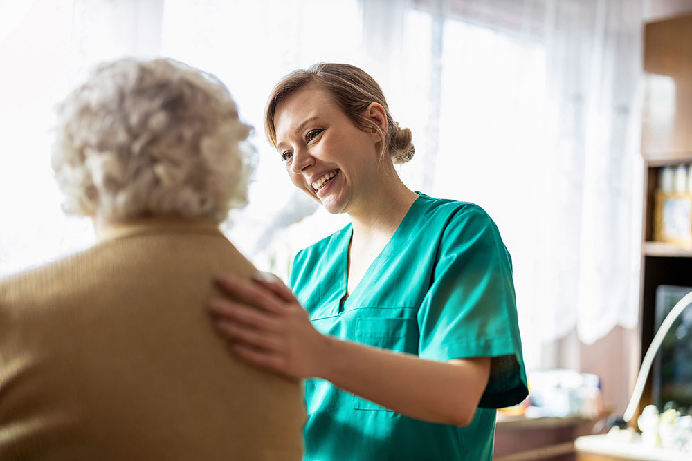 nurse-homevisit-patient at home visit with a nurse and patient